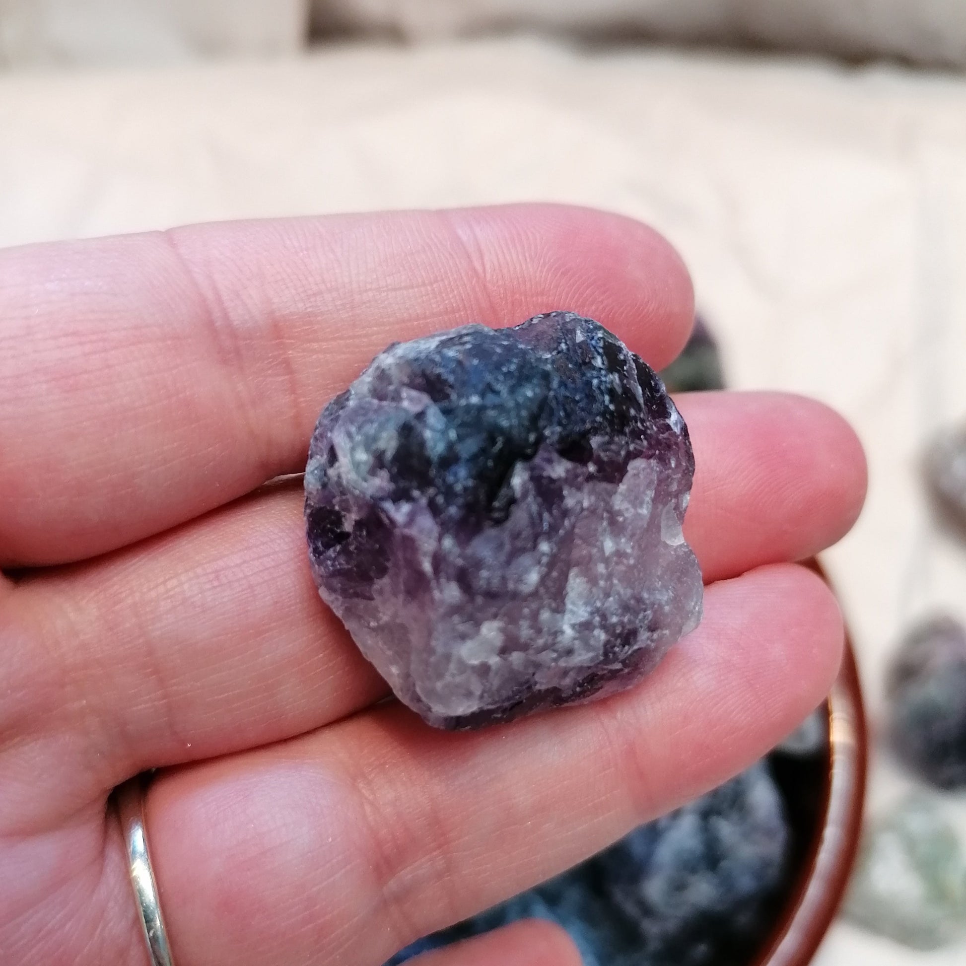 green white and purple raw fluorite chunks