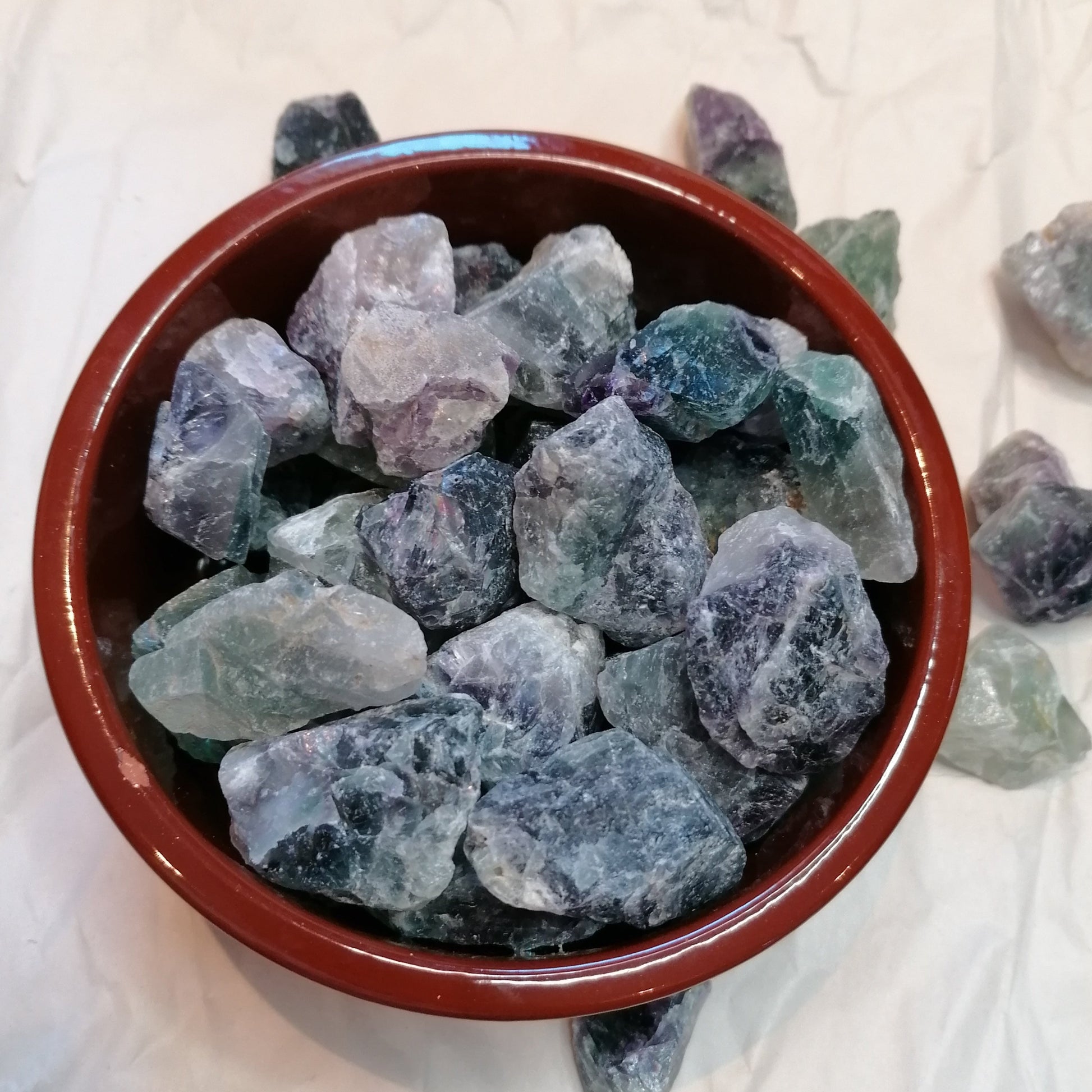 green white and purple raw fluorite chunks