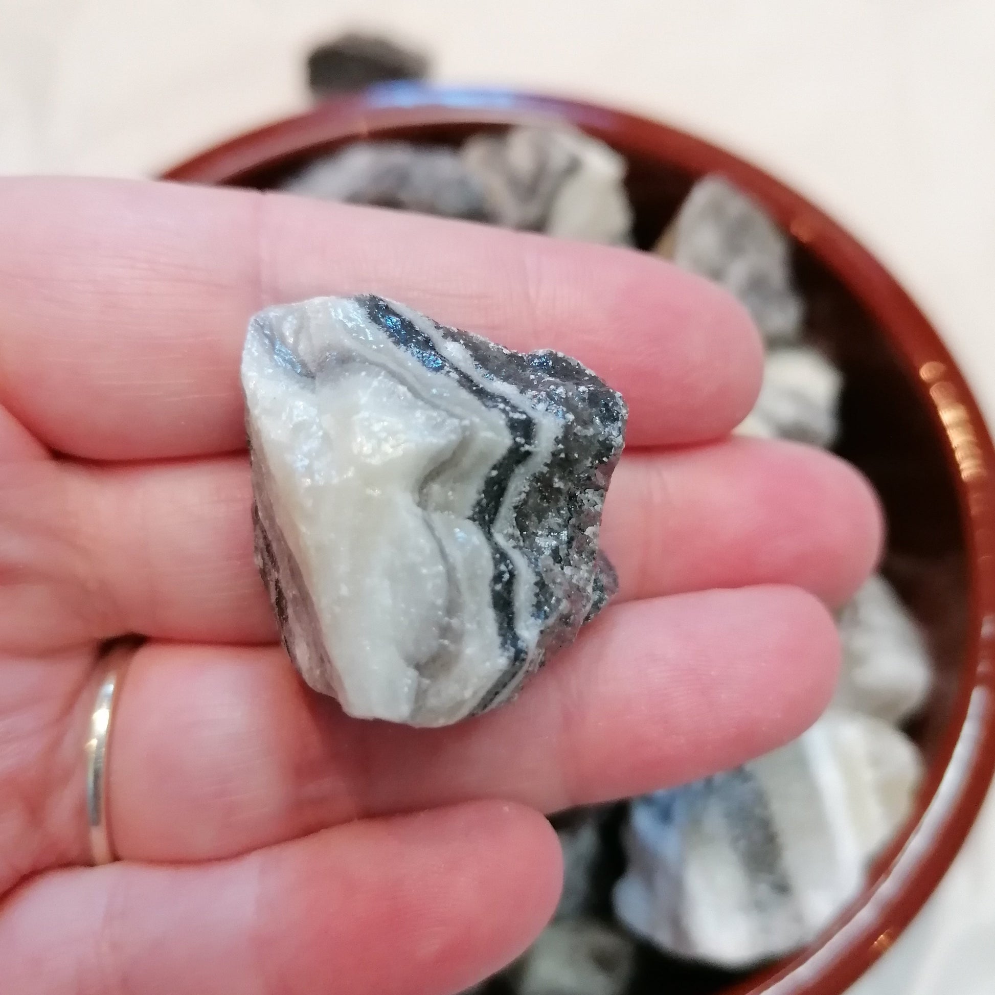 Yellow white and black banded raw zebra calcite chunk