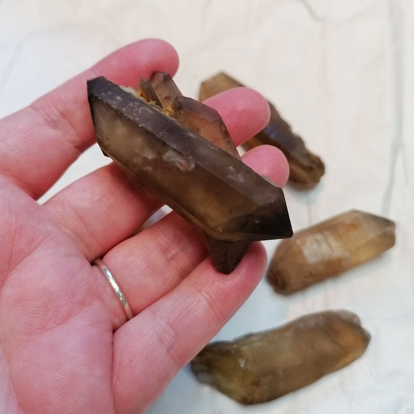 a natural raw dark amber citrine crystal point