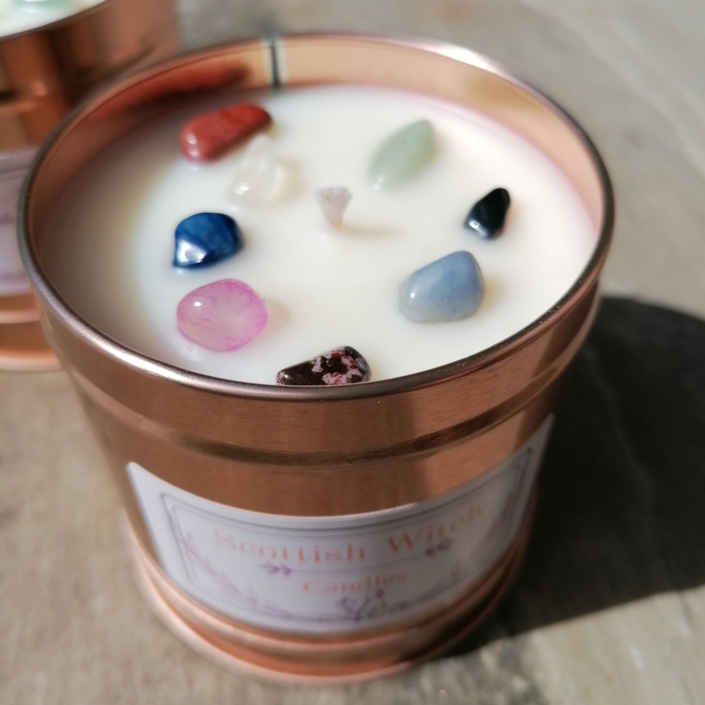 White candle in rose gold tin decorated with mixed colour crystal chips