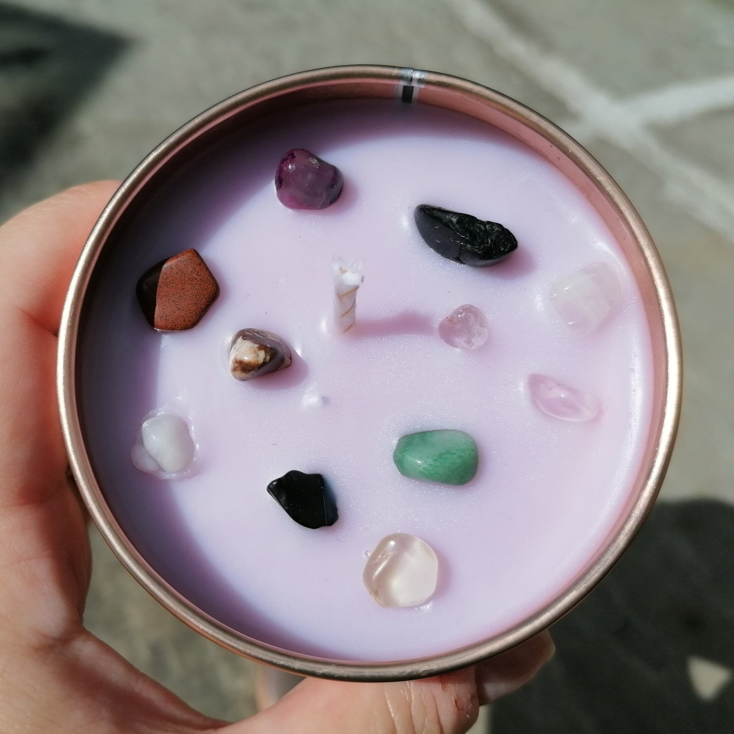 purple candle in a rose gold tin decorated with mixed colour crystal chips