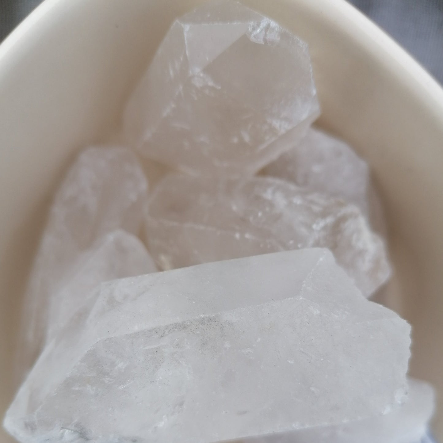 a dish of large clear quartz points