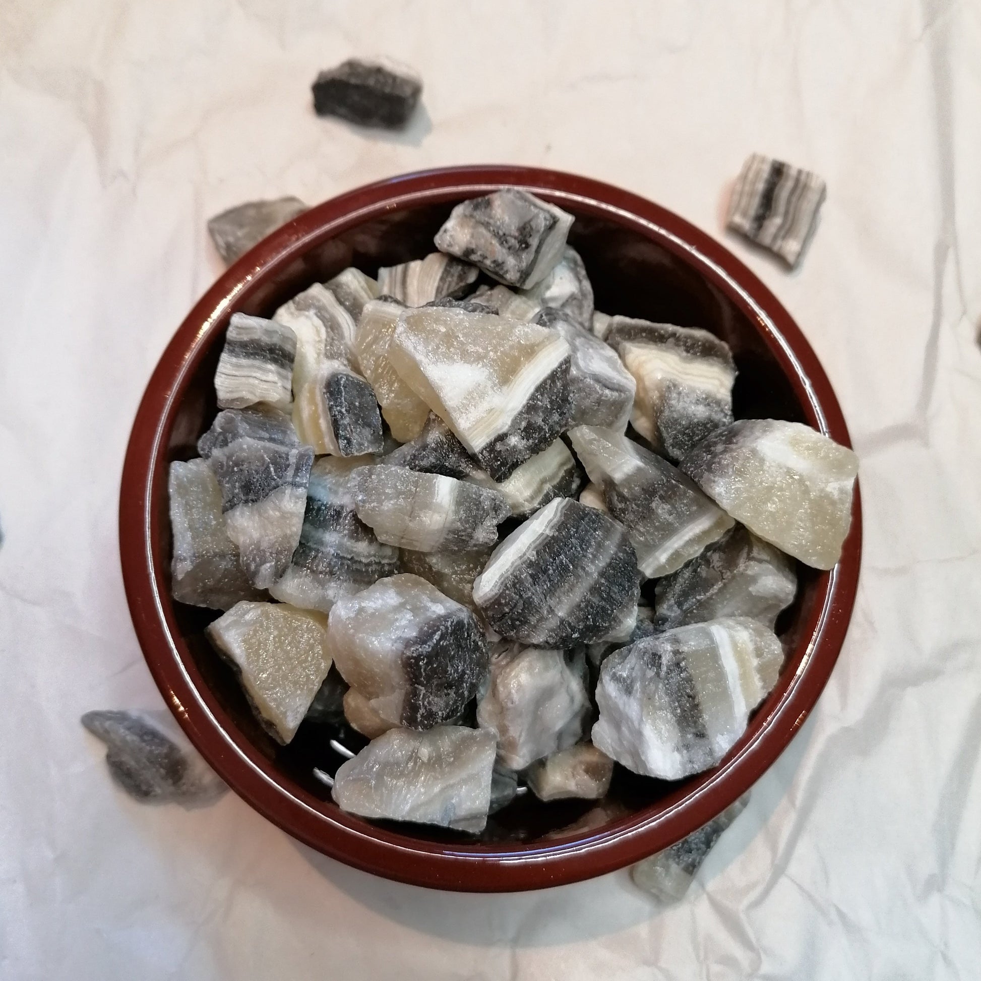 Yellow white and black banded raw zebra calcite chunk