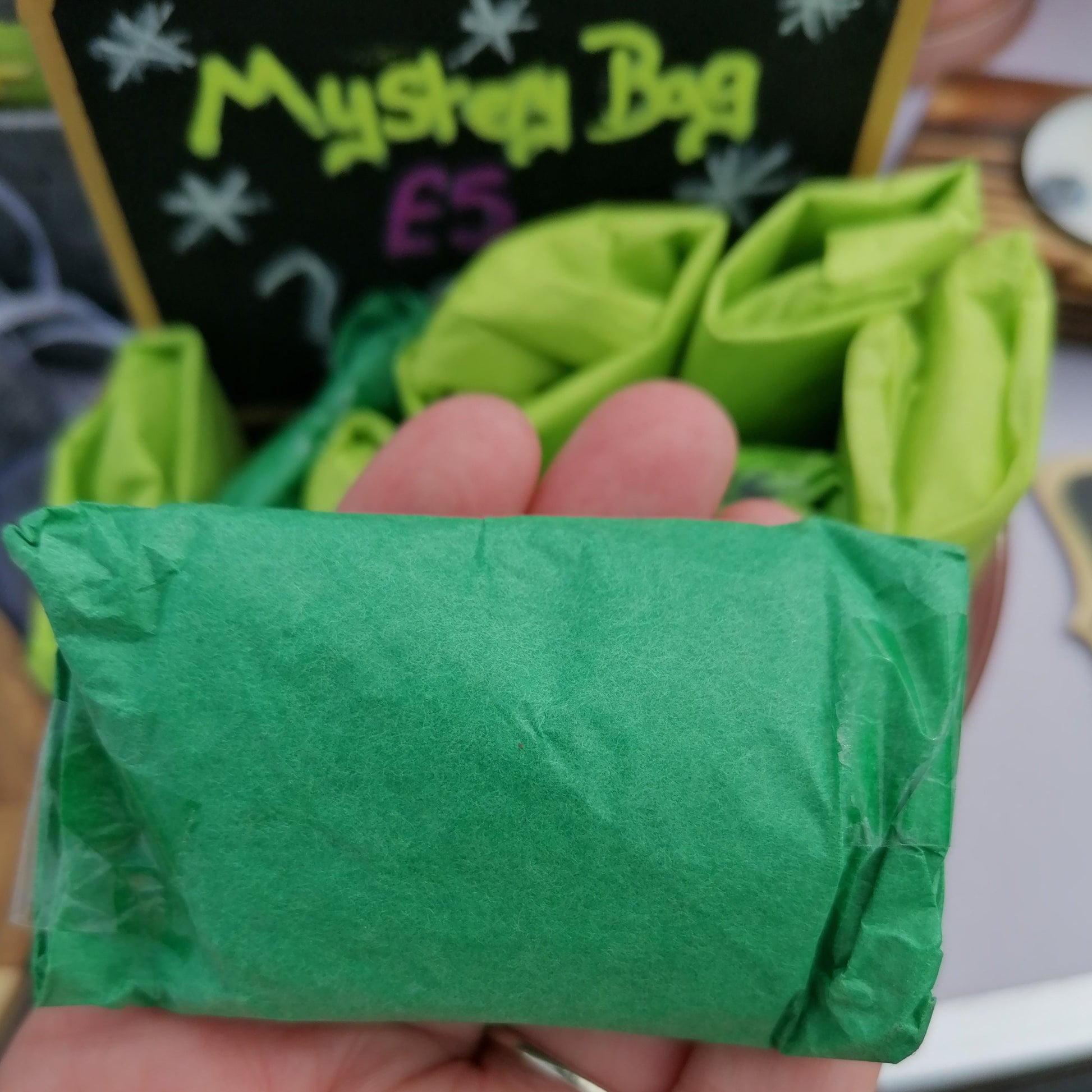 green tissue wrapped lucky dip parcels