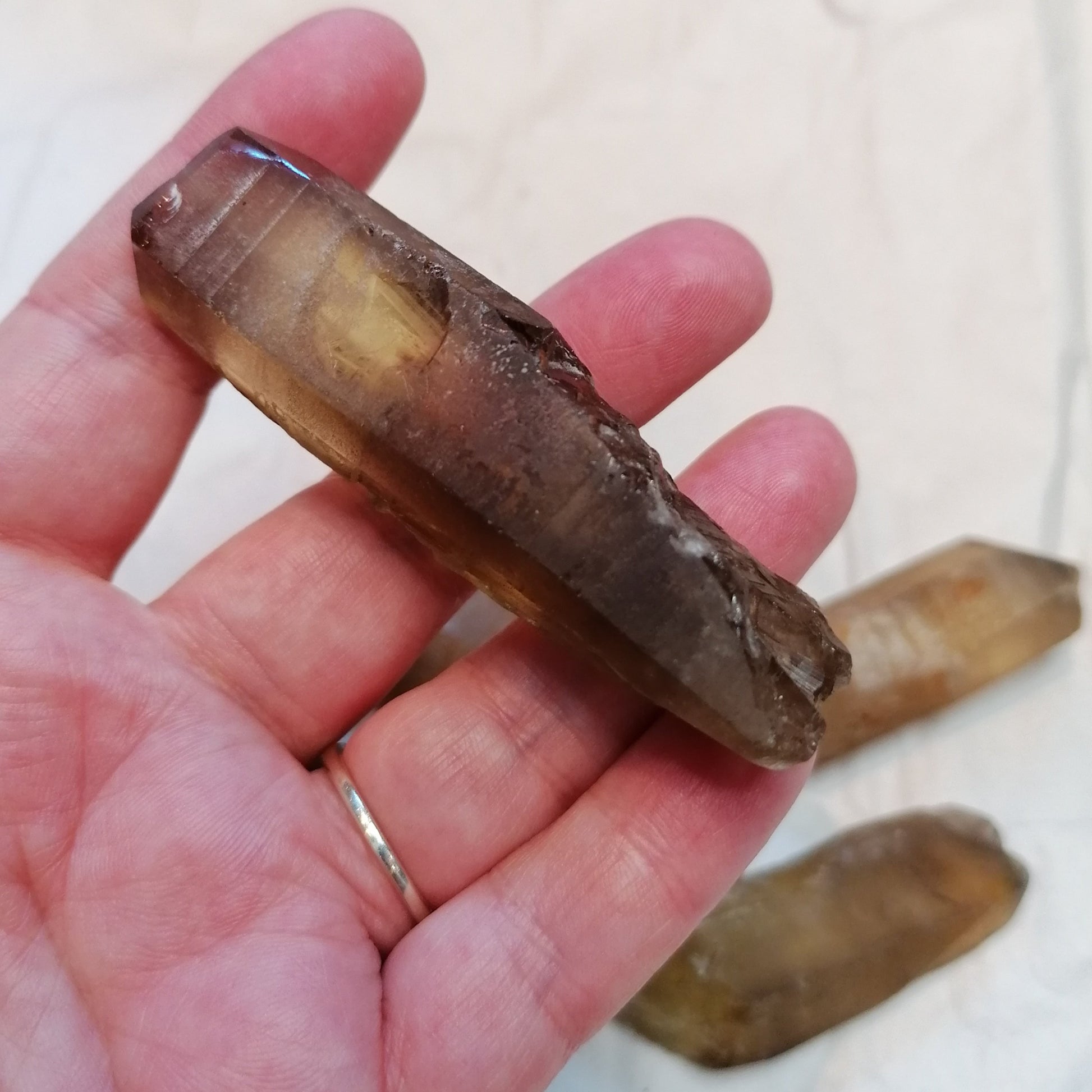 a natural raw dark amber citrine crystal point