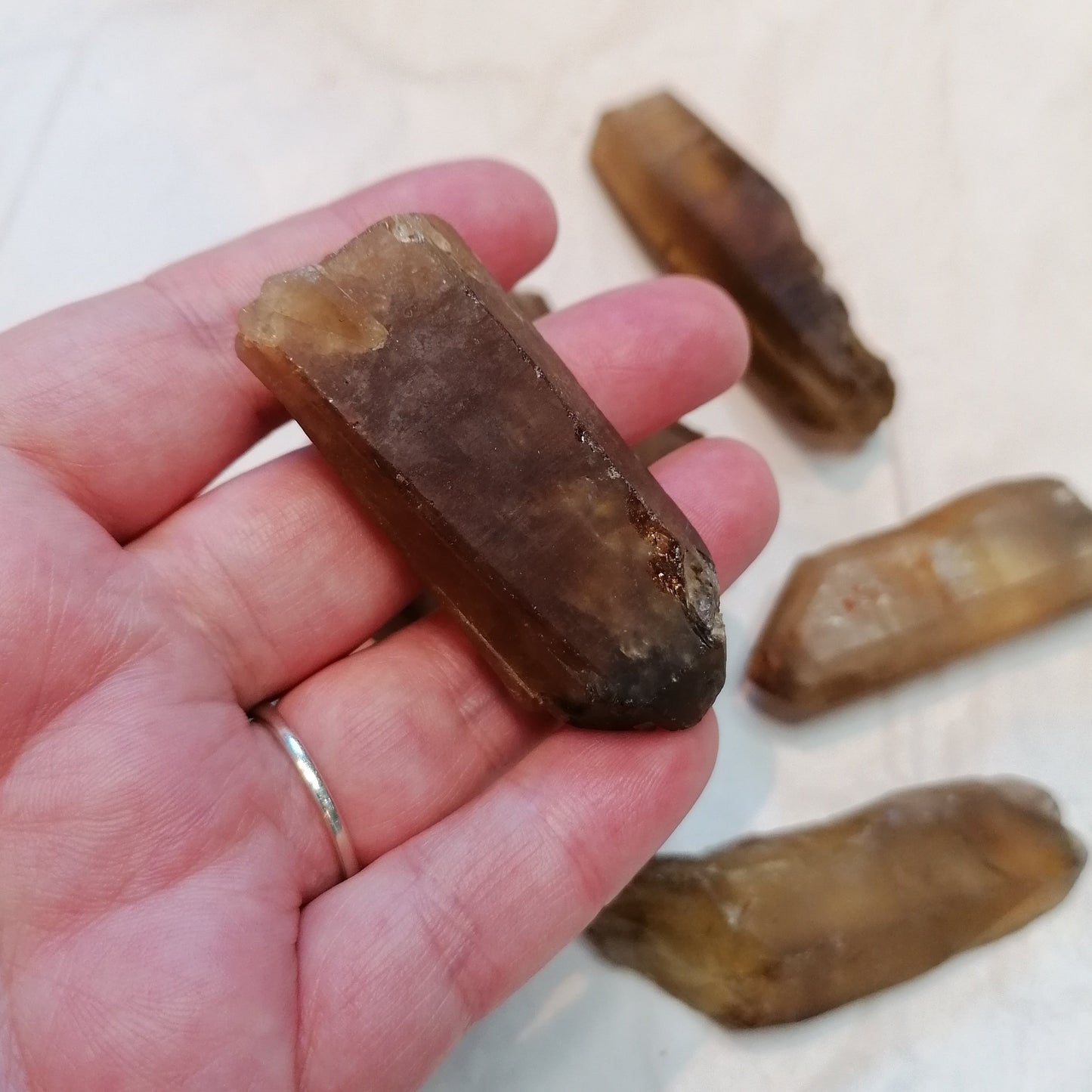 a natural raw dark amber citrine crystal point