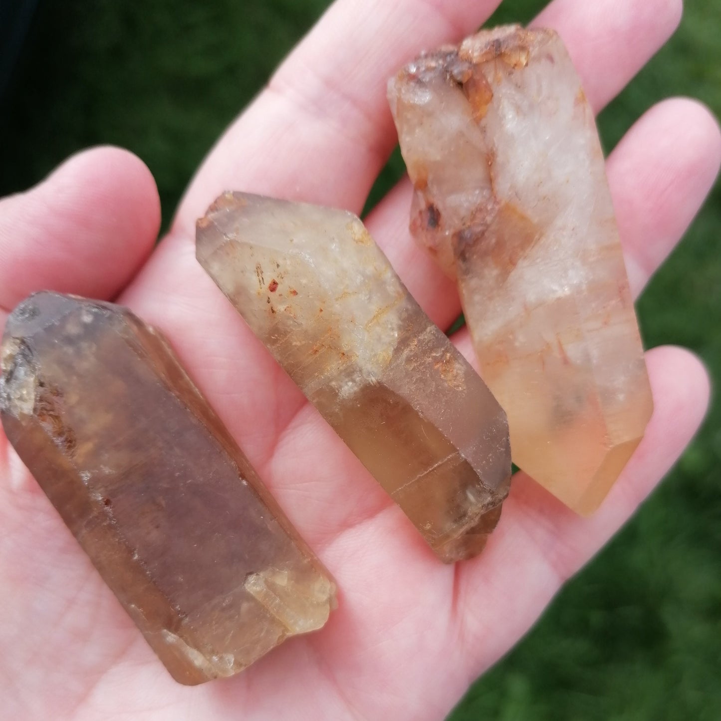 three natural raw dark amber citrine crystal points