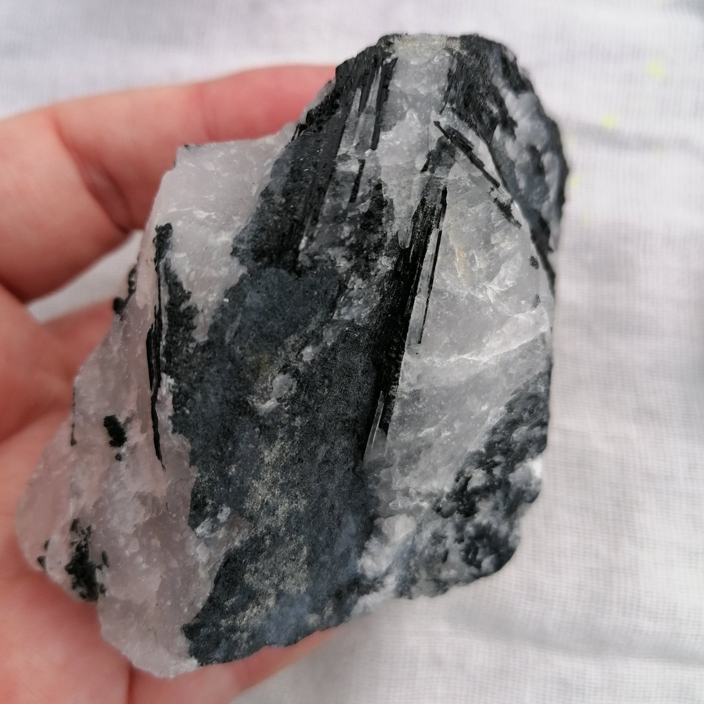 White quartz with black tourmaline strands running through