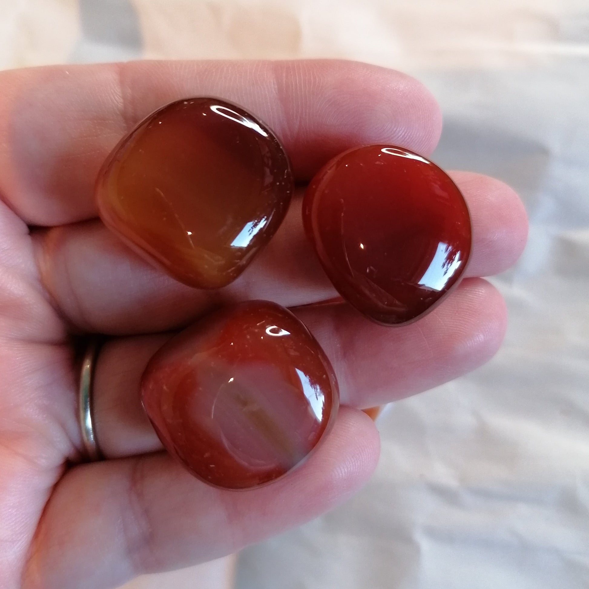 three red carnelian crystal tumblestones