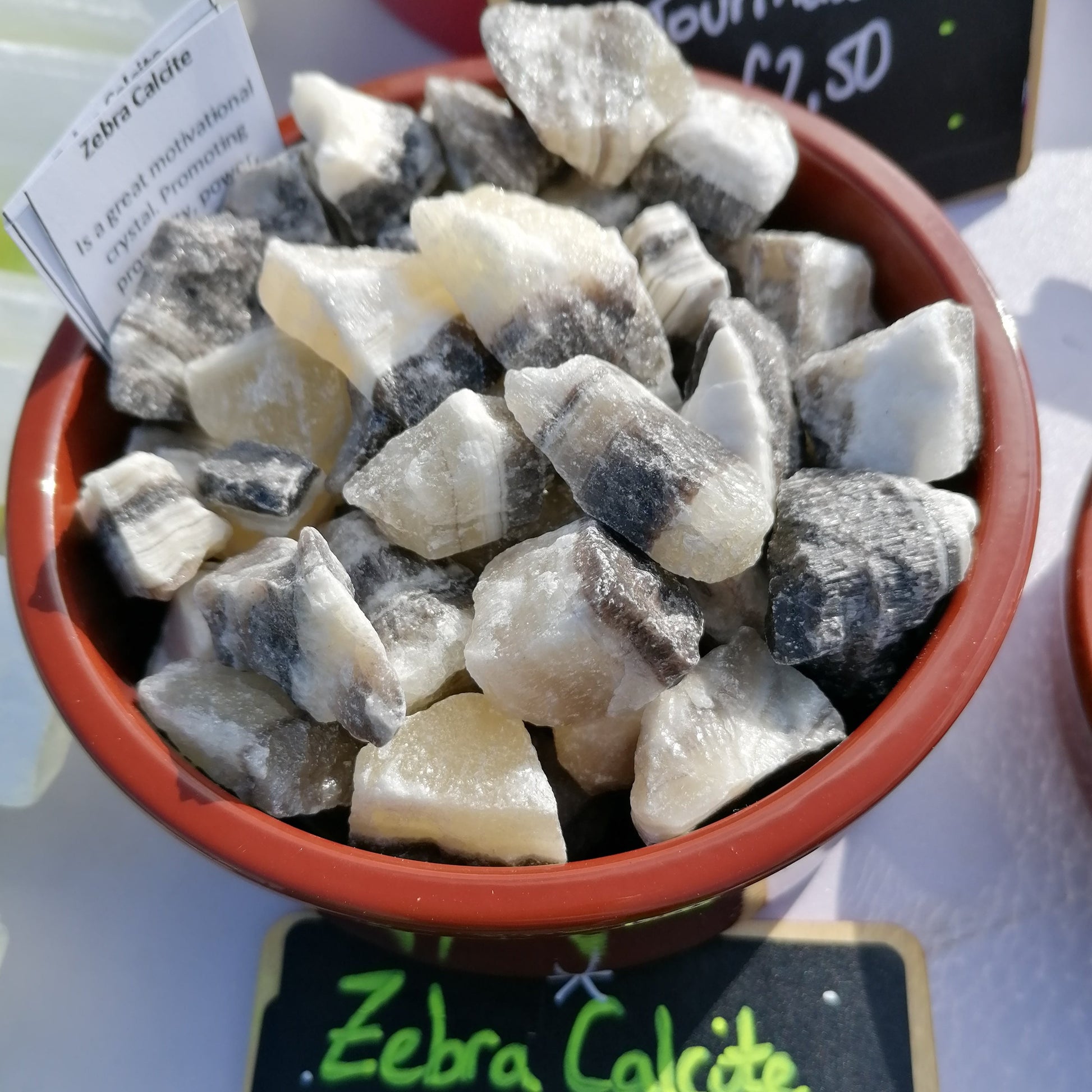 Yellow white and black banded raw zebra calcite chunk