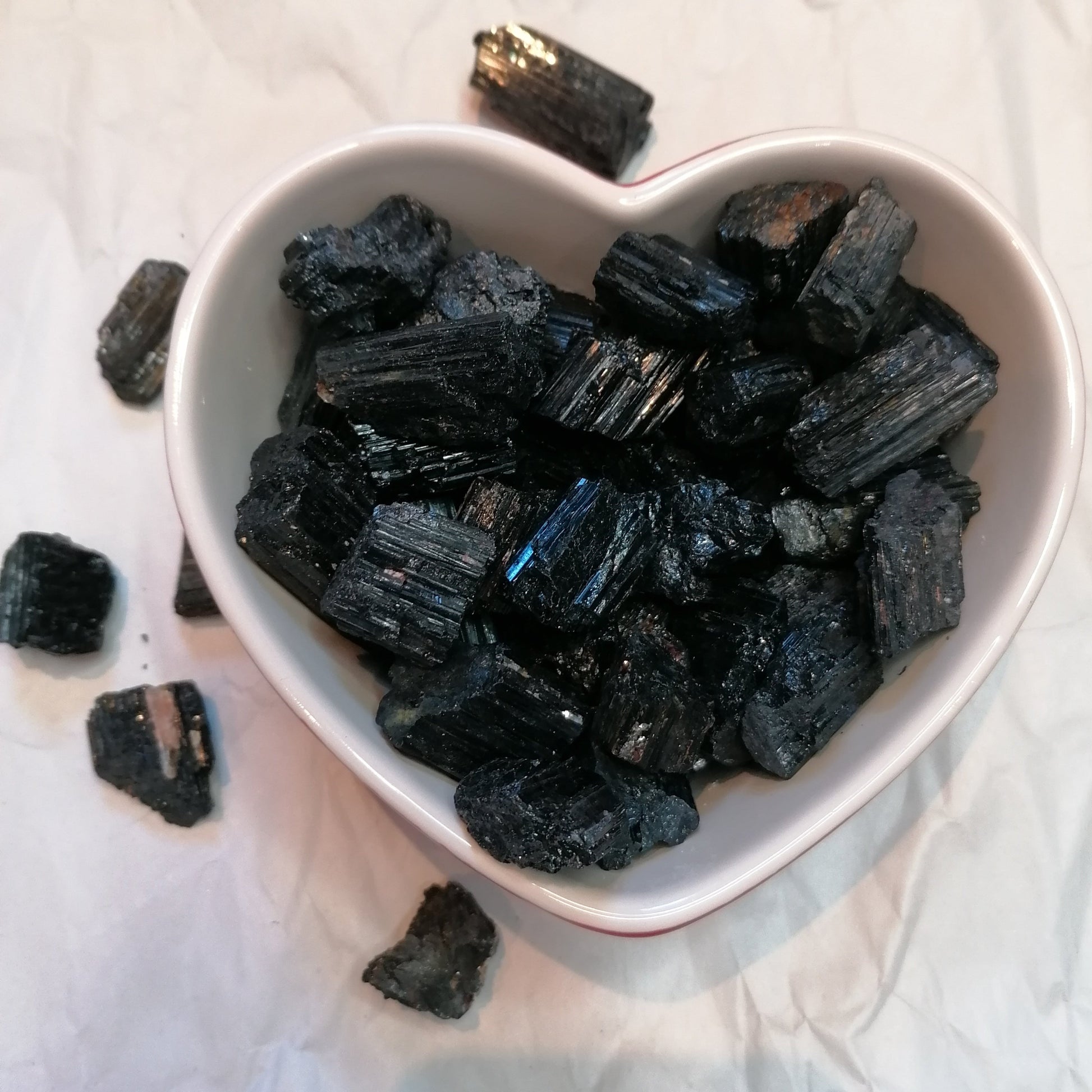 a dish of black tourmaline chunks