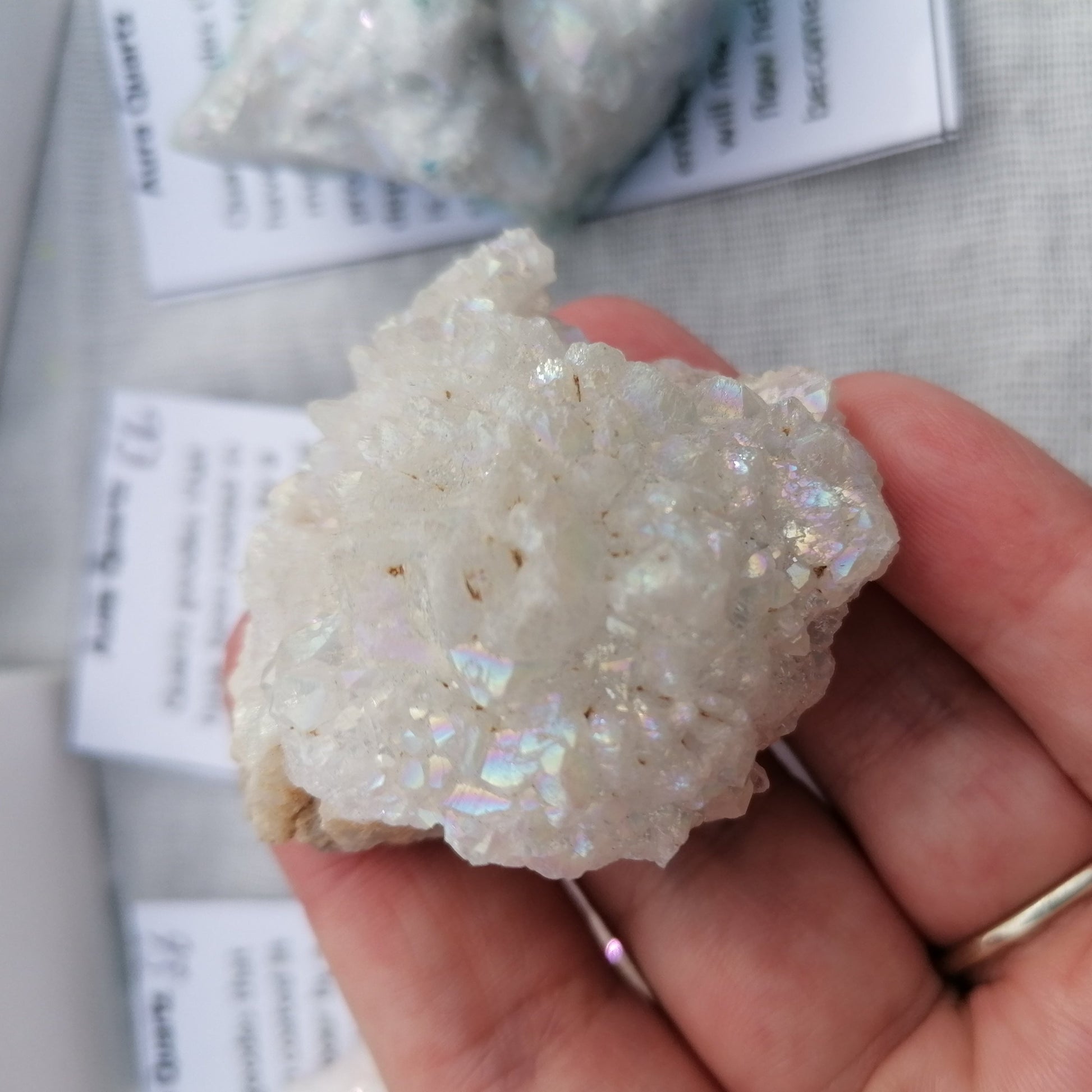 a white aura quartz druzy with rainbow shine