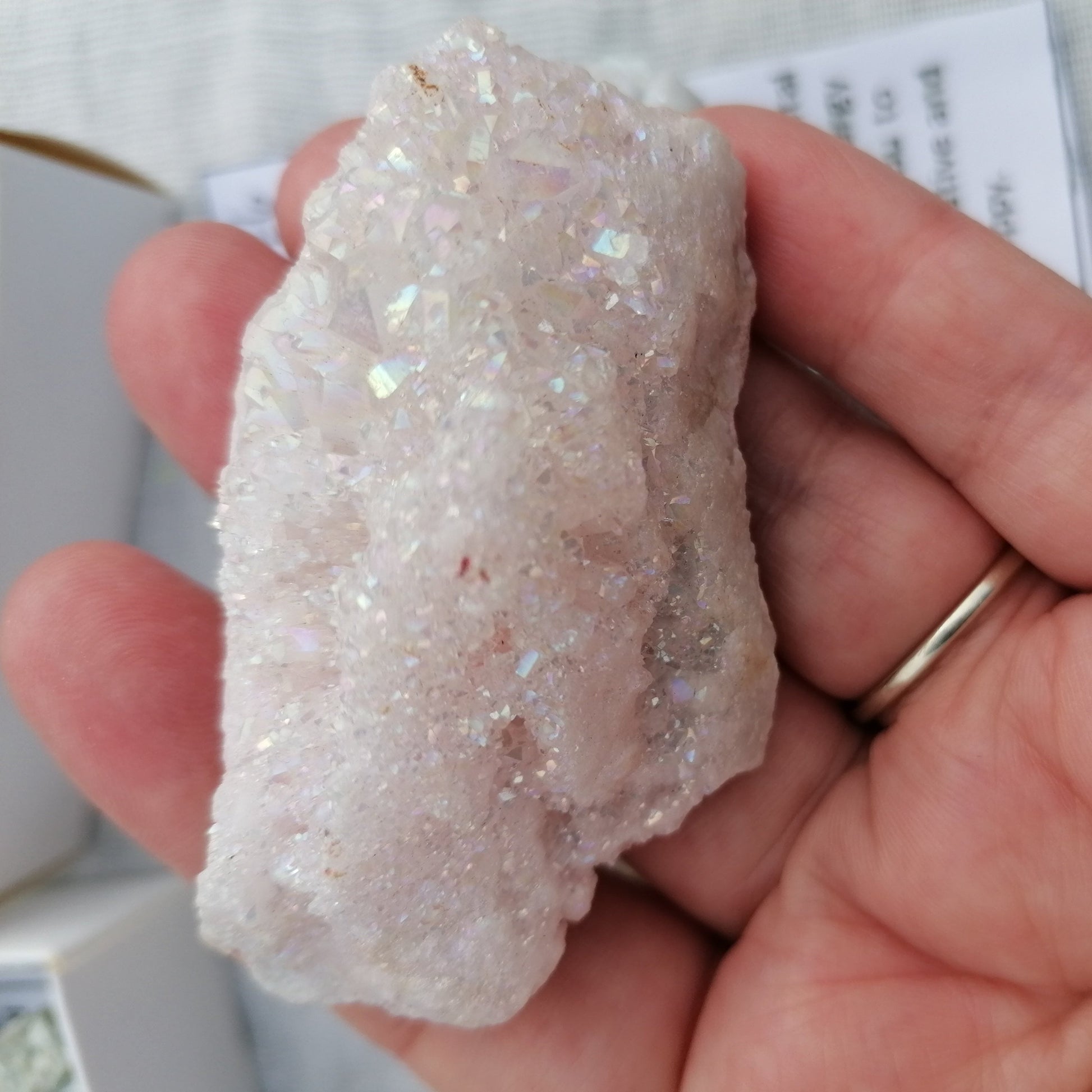 a white aura quartz druzy with a rainbow shimmer