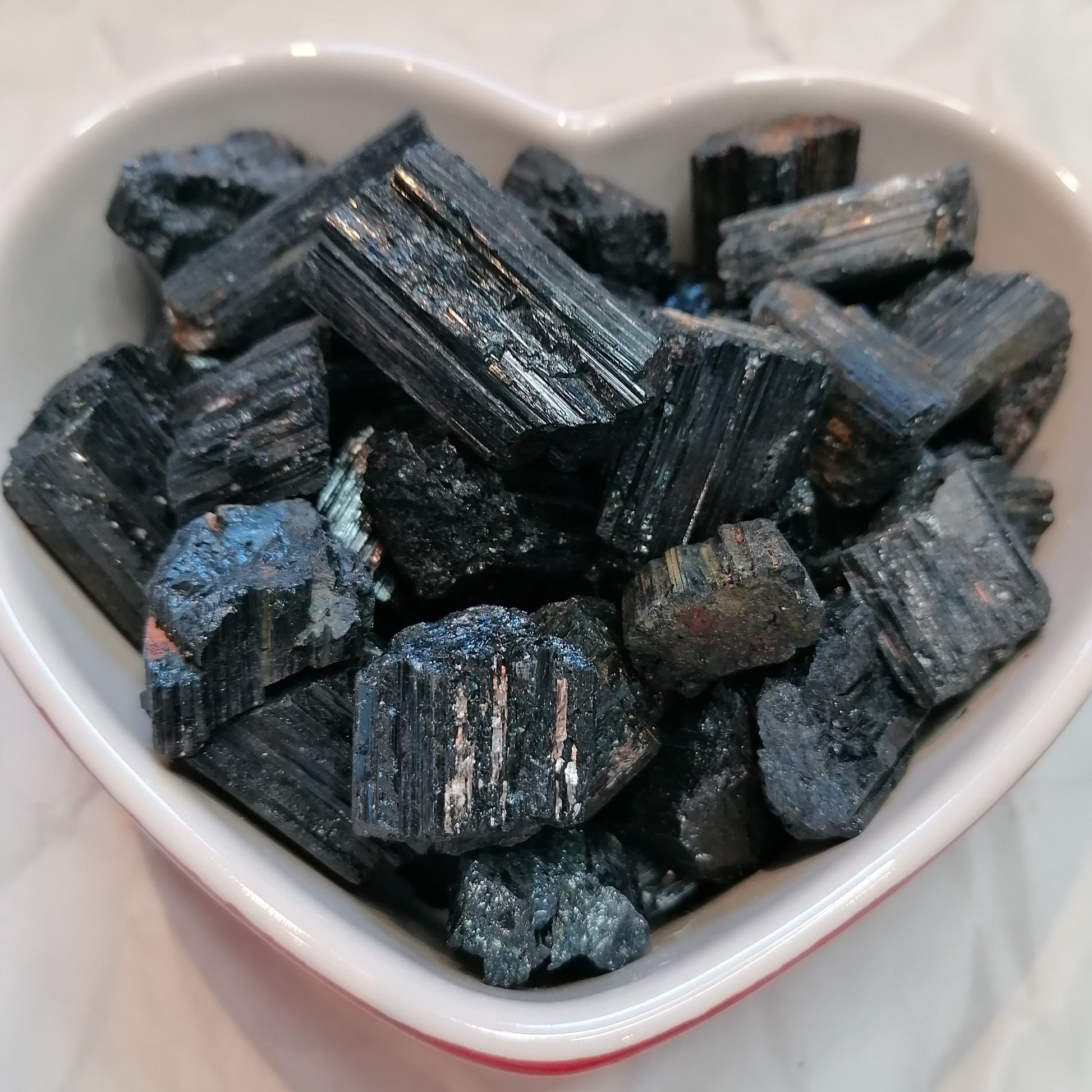 a dish of raw black tourmaline chunks