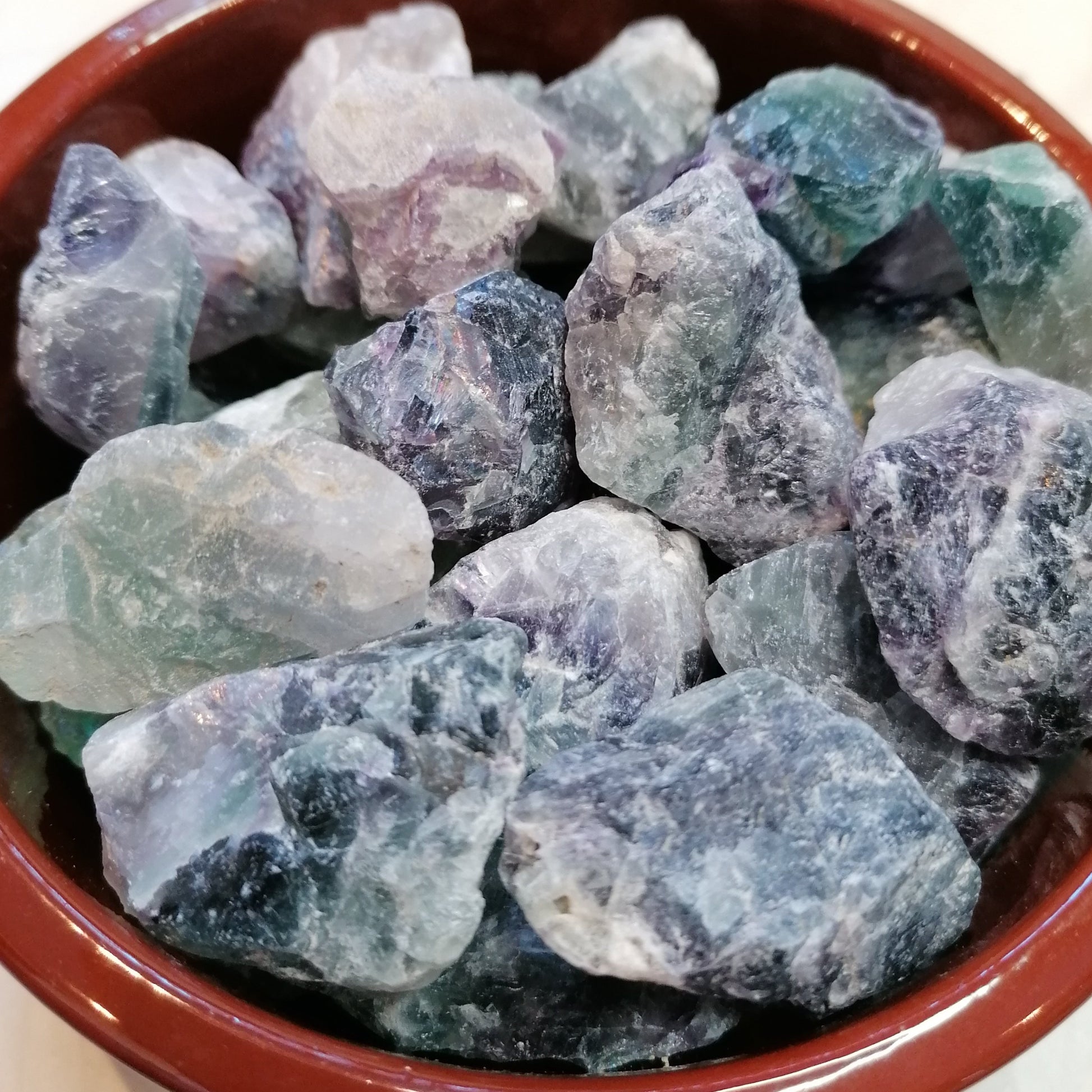 green white and purple raw fluorite chunks