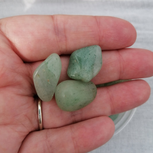 three pieces of light green aventurine small tumblestones