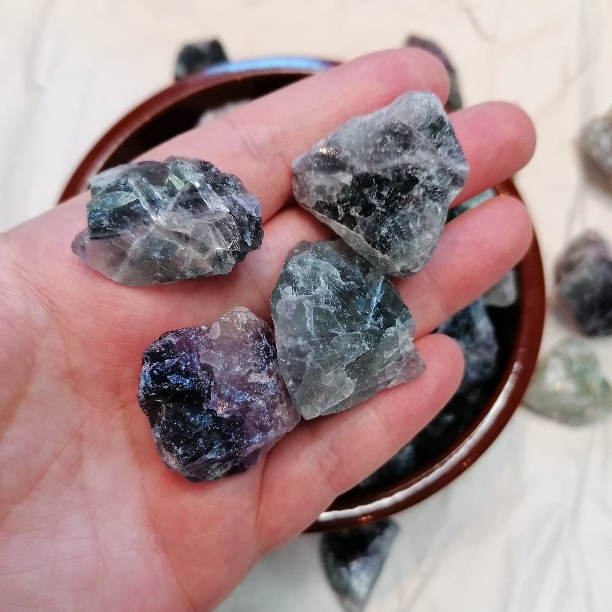 green white and purple raw fluorite chunks