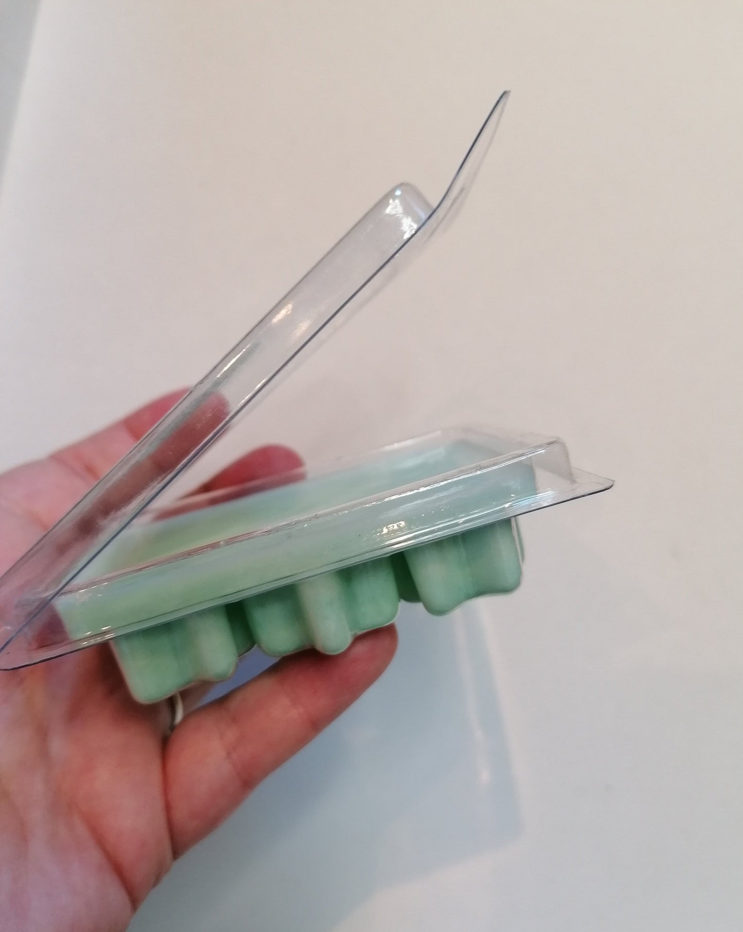 green wax melt open clamshell side view