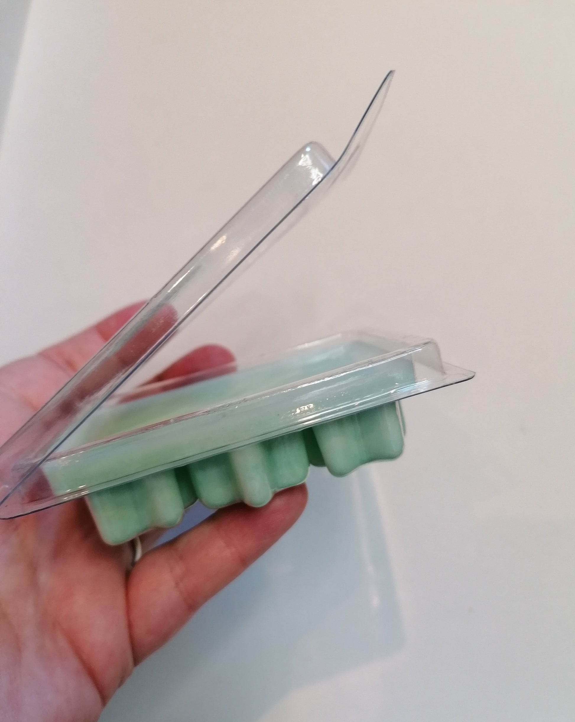 green wax melt open clamshell side view