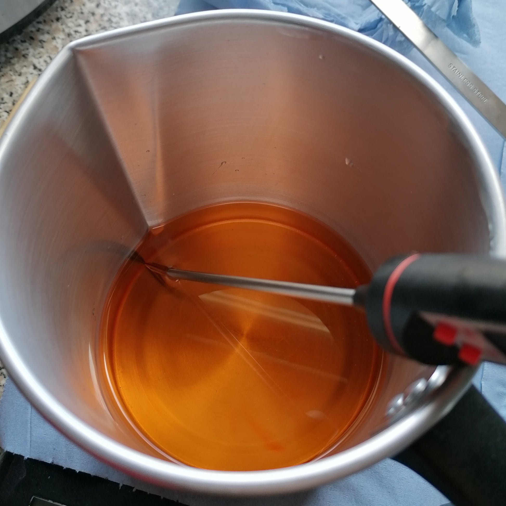 orange wax melted in pouring jug