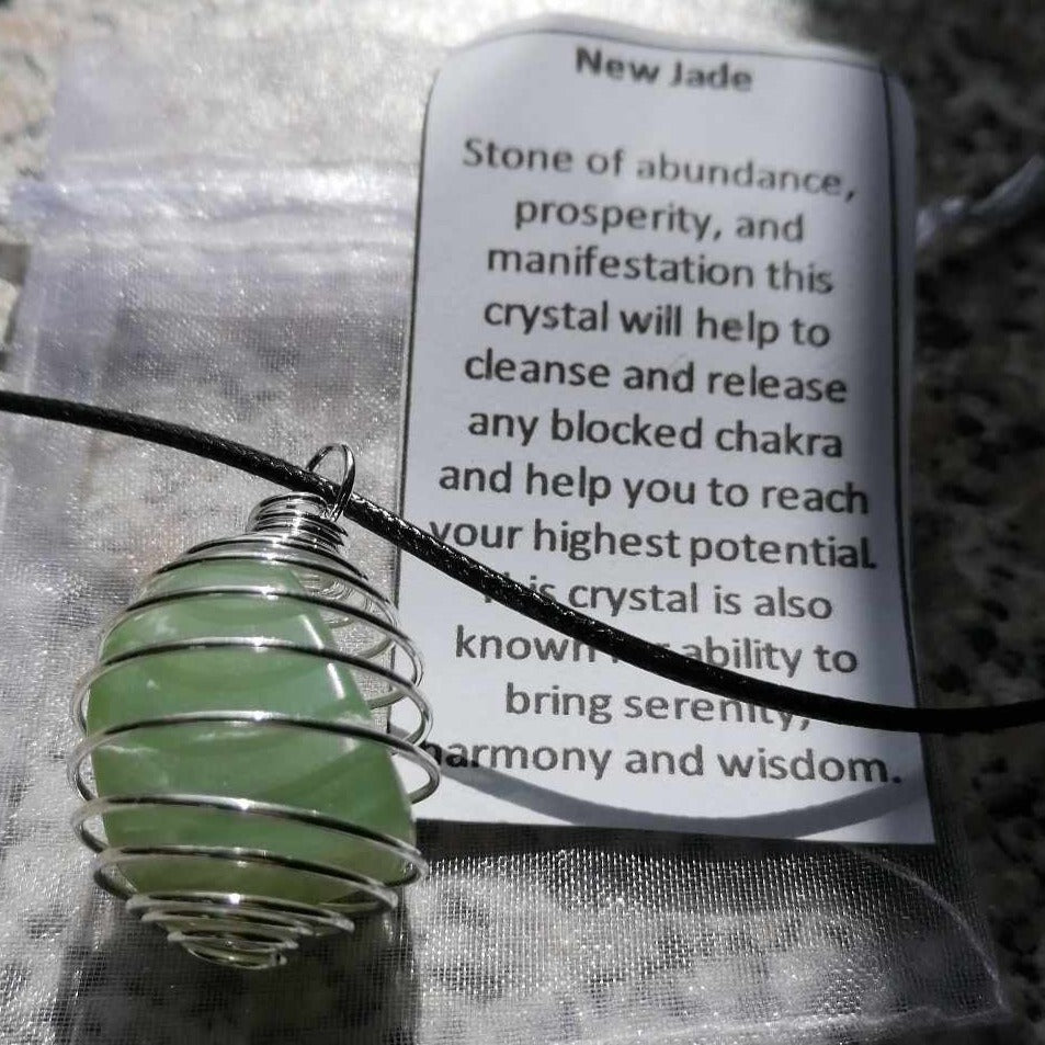 a spiral cage necklace with a green new jade crystal inside