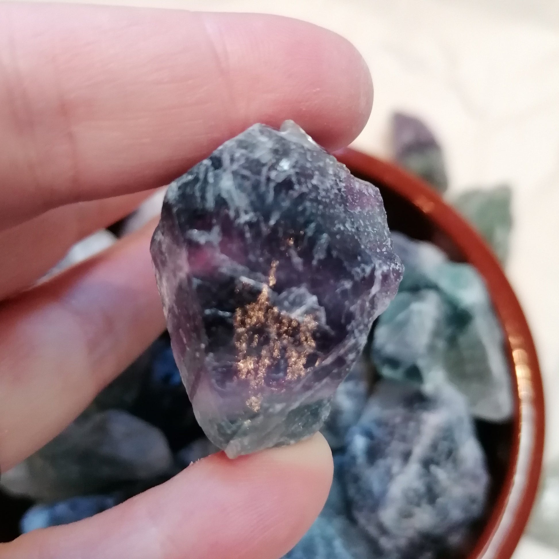 green white and purple raw fluorite chunks