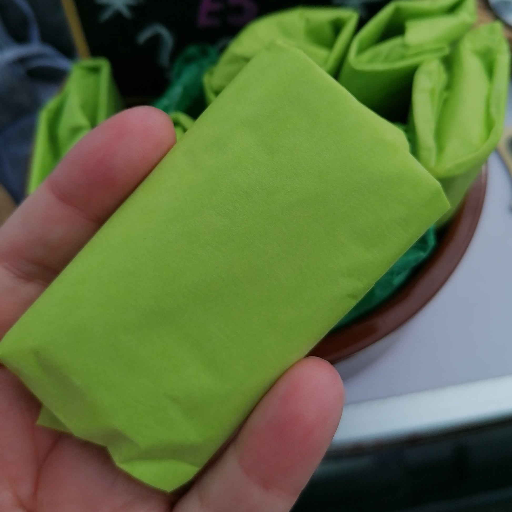 green tissue wrapped lucky dip parcels