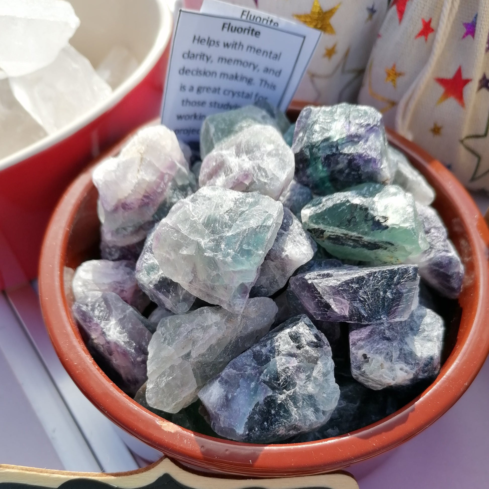 green white and purple raw fluorite chunks