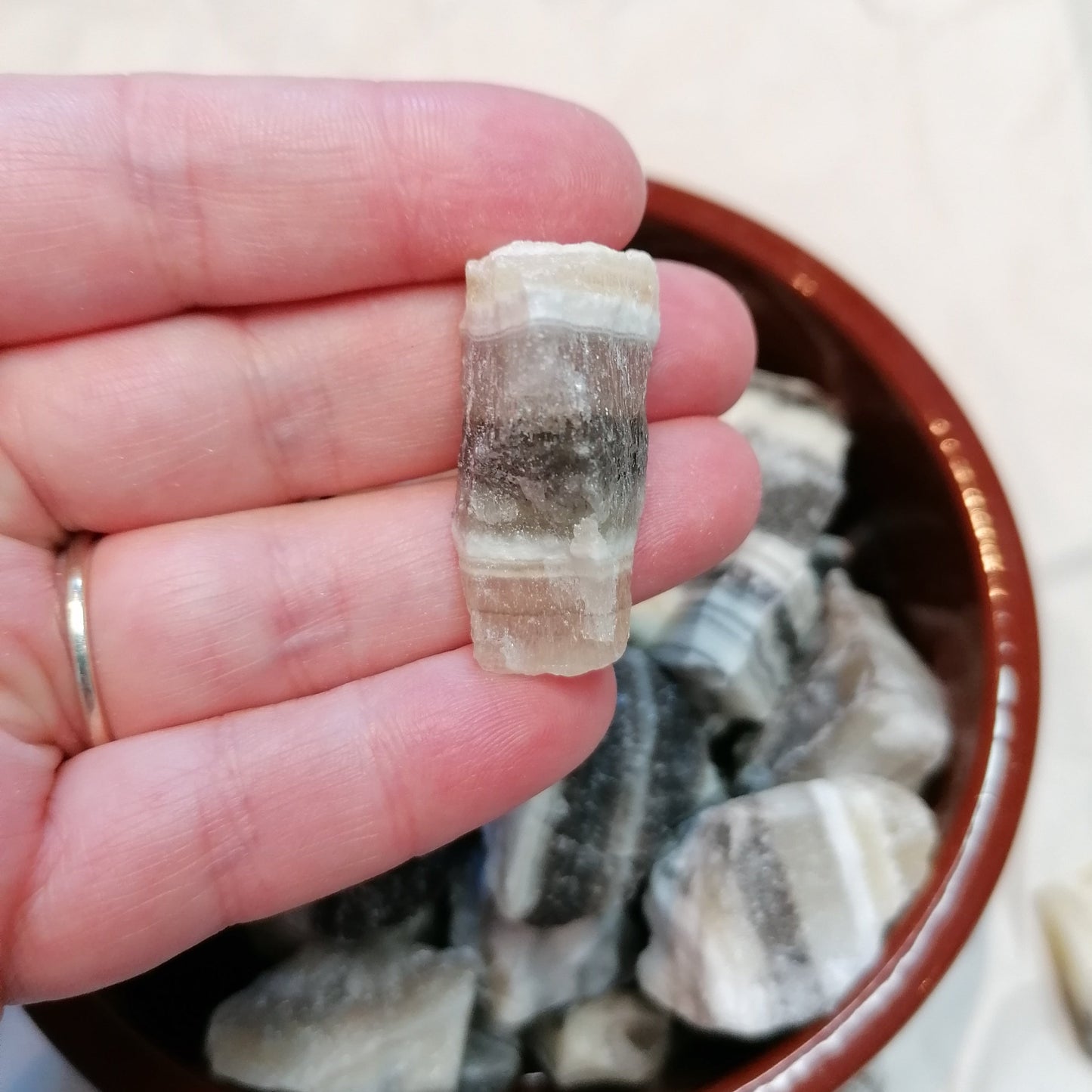 Yellow white and black banded raw zebra calcite chunk