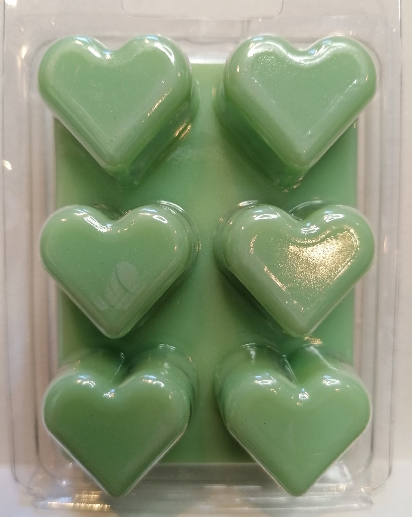 green wax melt in heart clamshell