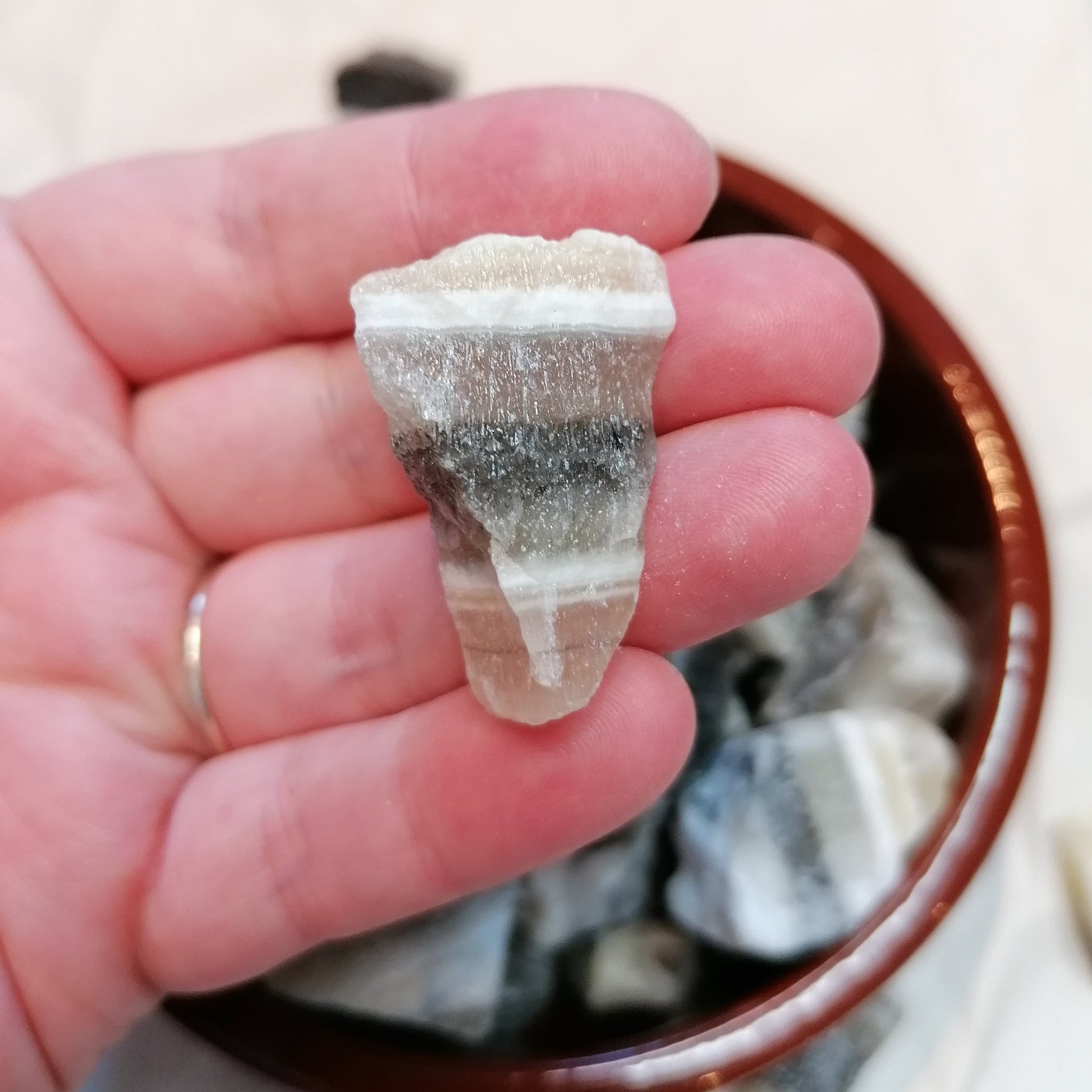 Yellow white and black banded raw zebra calcite chunk