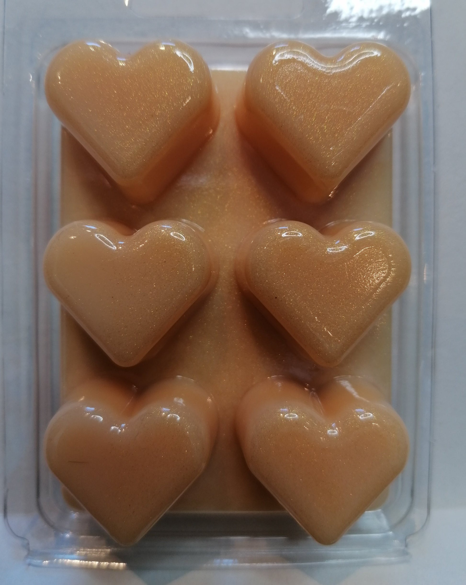 orange wax melt in heart clamshell