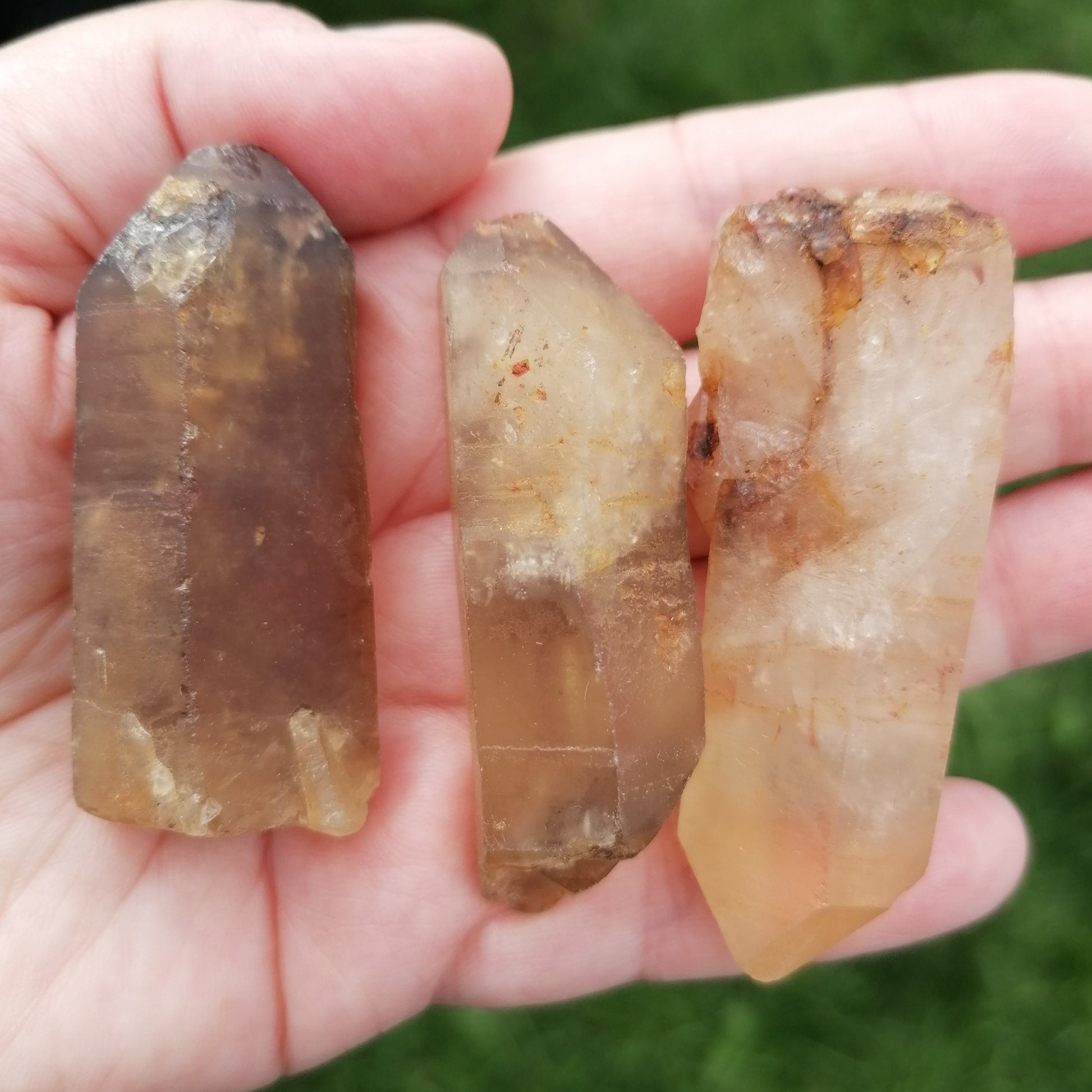 three natural raw dark amber citrine crystal points