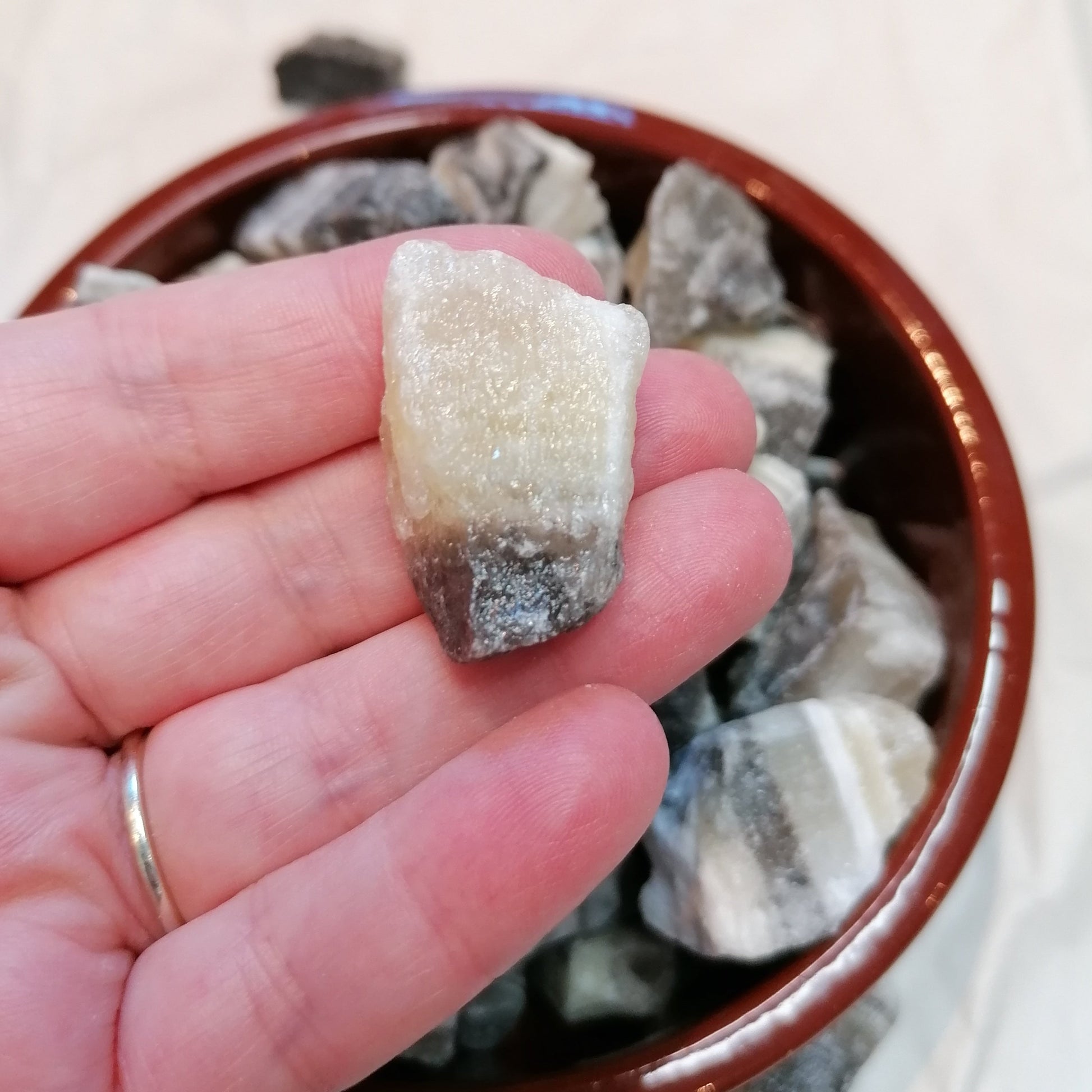 Yellow white and black banded raw zebra calcite chunk