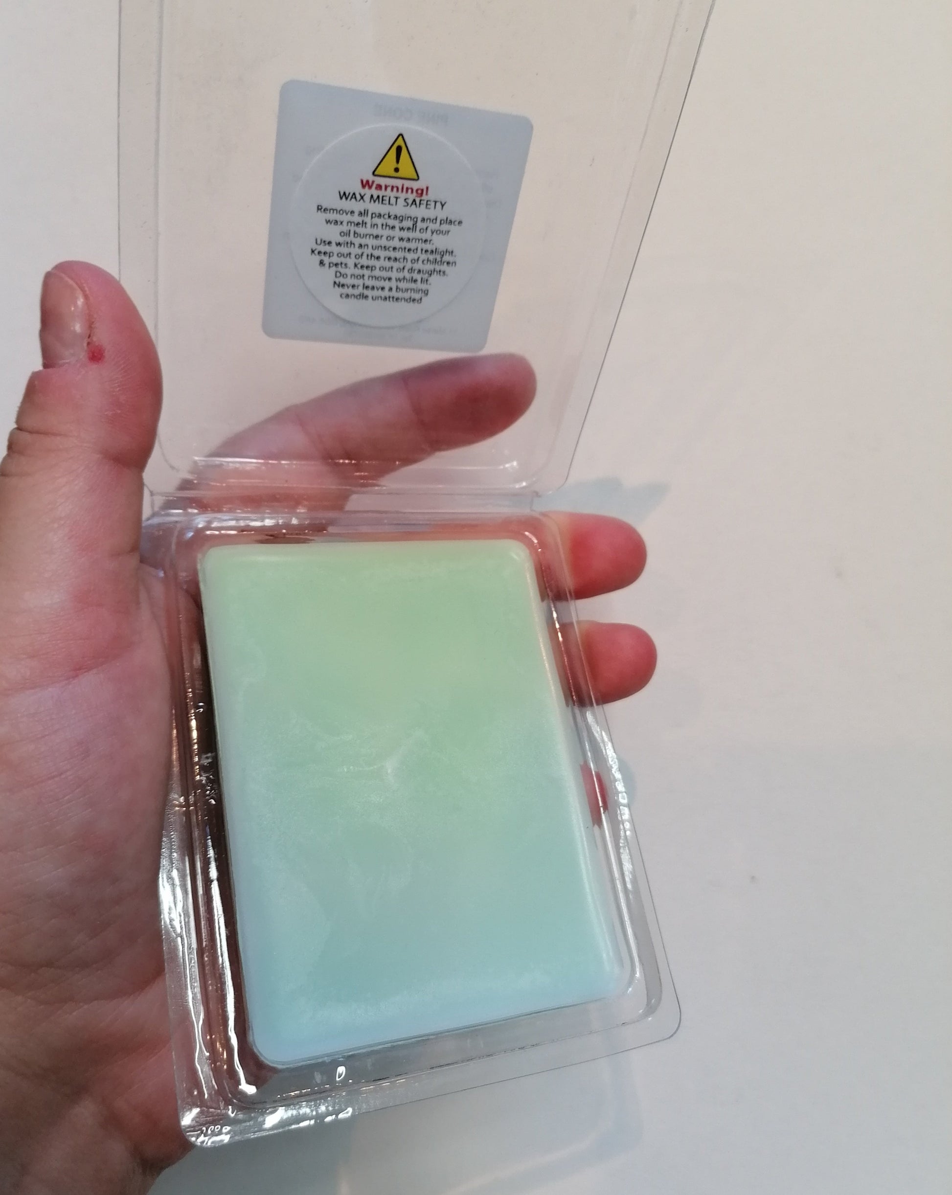 green wax melt open clamshell