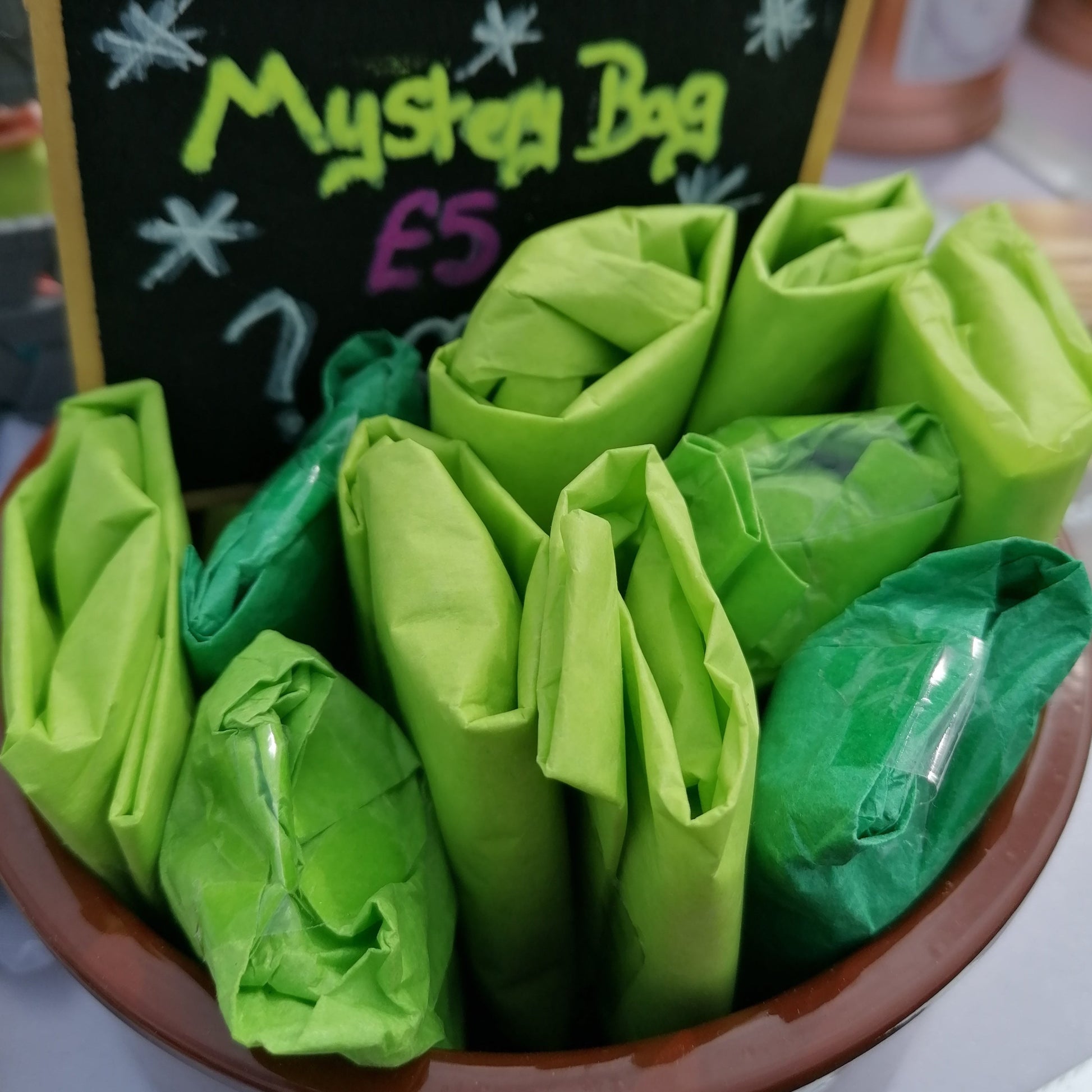 green tissue wrapped lucky dip parcels