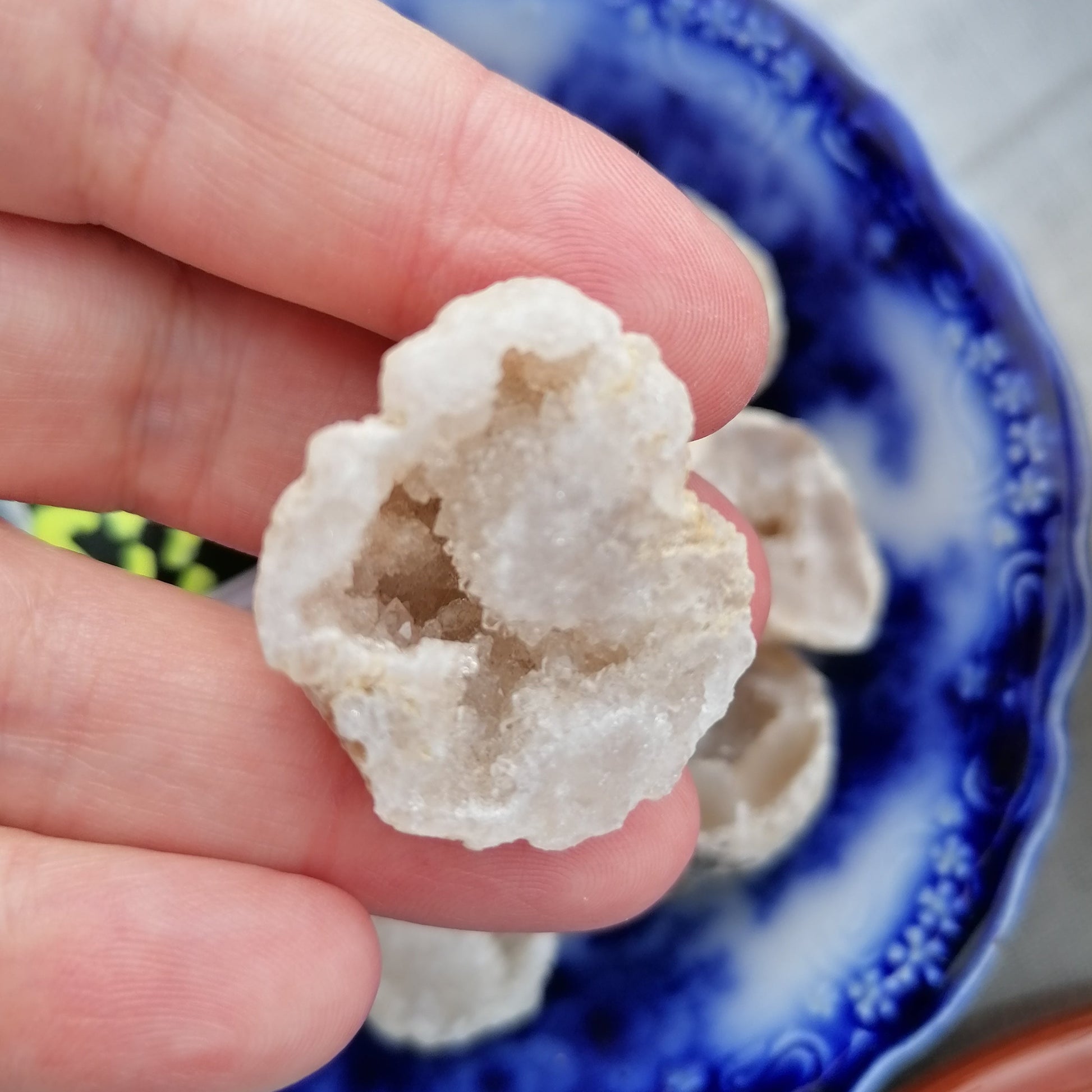 Half a white quartz druzy geode cut and polished