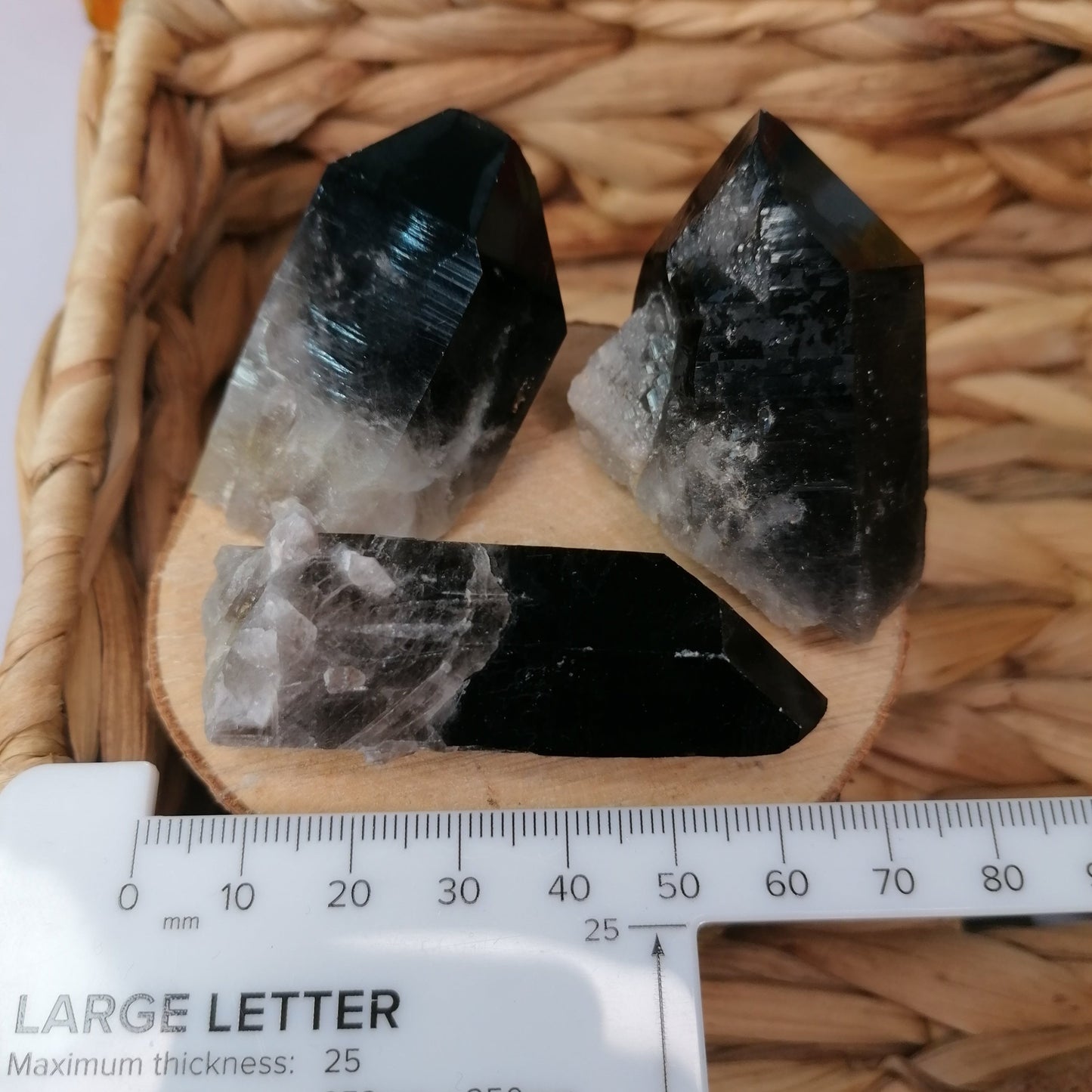 smokey quartz cluster points next to ruler to show size 50-60mm